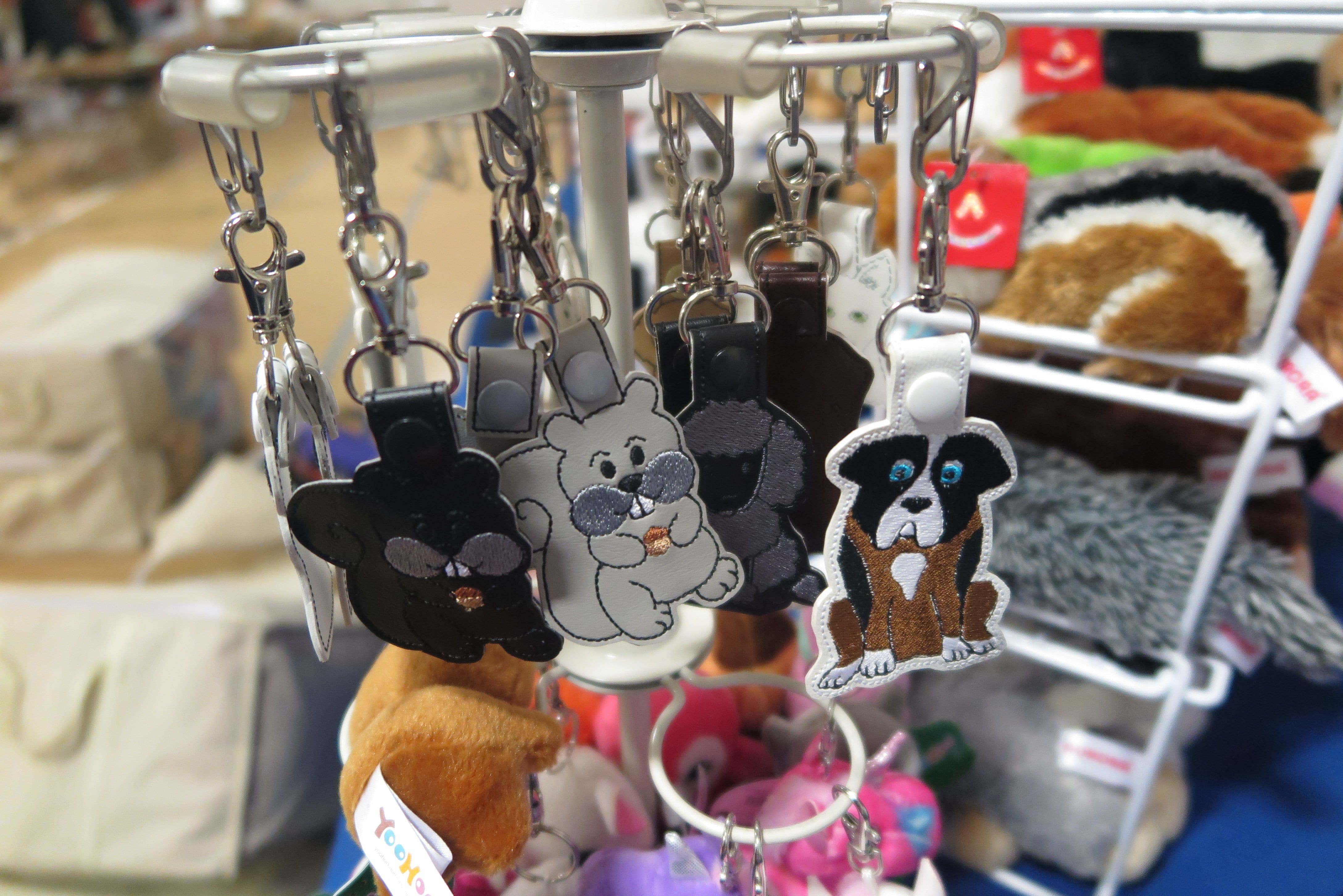 Key fobs of the Mortal Realm Witch Series characters. Featured are the grey and black squirrels from Tales of Familiars, and the St. Bernard Dog from Book Two.