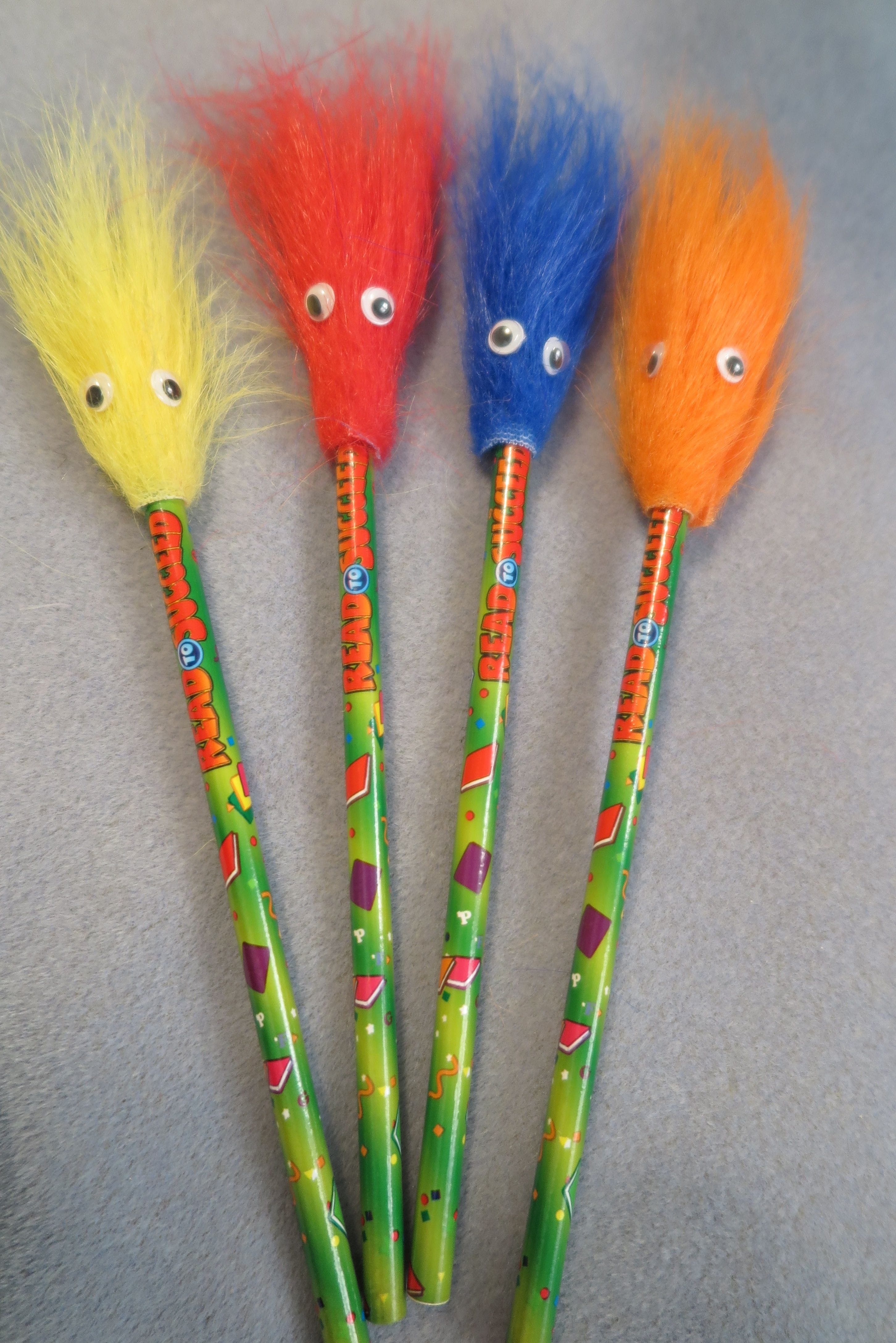 Pencils in various colors with fuzzy tops.